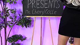 Oh wow, sexy milf in heels and glasses putting on leather harness! Domination time!