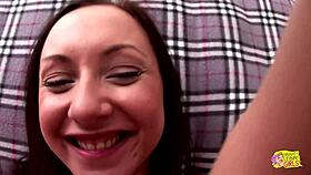 two brunette friends kiss and play with a dildo