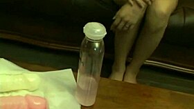 asian babe plays with toys in a solo session