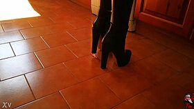 in the er, a tall mistress in heels dominates her slave with bdsm