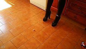 in the er, a tall mistress in heels dominates her slave with bdsm