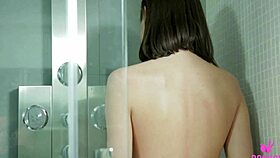 Dark haired brat andy fucks her trimmed pussy during the shower time