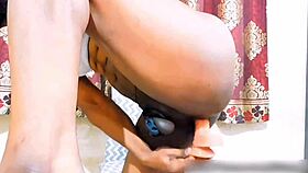 Young girl bent over in cage getting doggystyle with strapon and toys on big clit