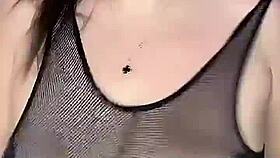 She fucks those huge natural tits in stockings on the mesh!