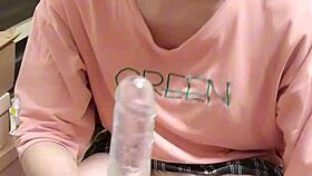 Shemale Ting Xuan performs blowjob on dildo