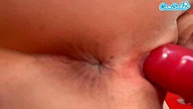 What happens when a sexy hot brunette cheerleader masturbates with a dildo in the locker room