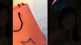 Beautiful brunette tries outfits in public store fitting room