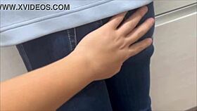 petite asian girl shyly introduces her underwear while hiding with towel