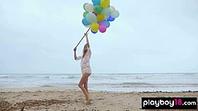 Skinny Italian MILF Blondie Fancie Torino undresses and plays with balloons naked on the beach