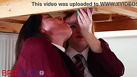 Two college students passionately milk a guy's cock, covering their uniforms in cum