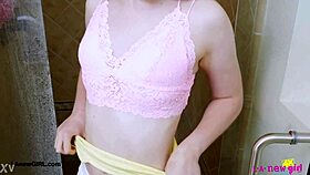 bright-eyed blonde enjoys a relaxing shower