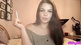 Xo bunny, the brunette Latina with blue eyes, smokes and blows smoke in your face