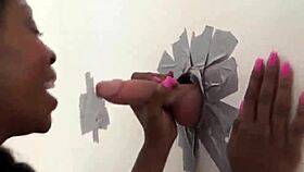 Brie Simone interacts in glory hole setting