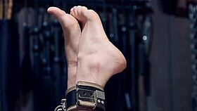 clamped with pins blonde is suspended in bdsm