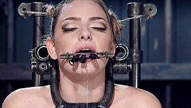 clamped with pins blonde is suspended in bdsm