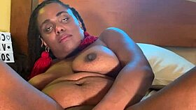 why does that ebony beauty fuck herself with a dildo in the bedroom?