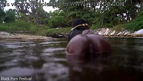 Dark Skinned African Woman Teases Playfully In The Water