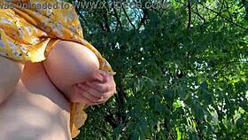 Pregnant milf milks lactating boobs outdoors.
