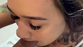 tattooed hottie sitting and chatting casually