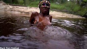 Dark Skinned African Woman Teases Playfully In The Water