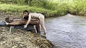 outdoor sex by the river with two hot girls sucking and cumming 😍