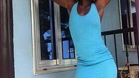 A crazy woman twerks wildly on the balcony under the open sky