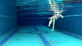 cute shy czech teen swims in pool with shorts