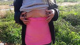 hey, check out this kinky babe flashing pierced nipples and ass on street?