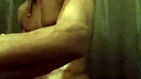 He's stroking his big black cock with loads of oil