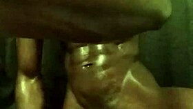 He's stroking his big black cock with loads of oil