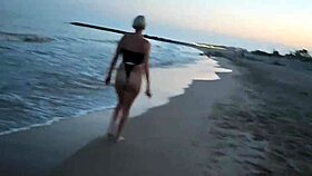 Blonde shows tits and sucks cock on a public beach