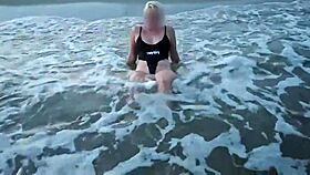 Blonde shows tits and sucks cock on a public beach