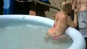 blonde girl chats on webcam showing pool fun in public favela spot