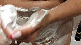 naked woman standing in the shower under the water