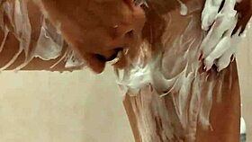 naked woman standing in the shower under the water