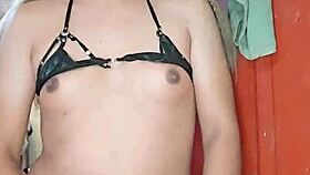 The transsexual masturbates with a rich penis in a calm setting