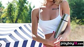 petite naked blondie eva tali stripping and taking sunbath at the beach