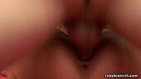 the blonde girl gets helped by someone and then receives a drink in her mouth