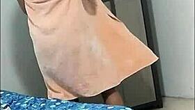 Is this what happens when I record a sexy brunette changing clothes? She starts masturbating.