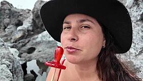 watch the brunette milf practice sucking on the beach