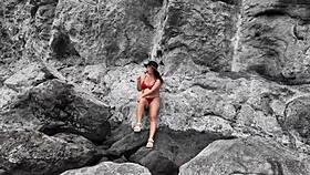 watch the brunette milf practice sucking on the beach