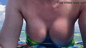 Hot italian milf artemisia love shows off big tits in micro bikini at public beach in miami