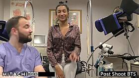 Behind the scenes, nurse Miss Mars teases patient with hitachi vibrator forcing shaved pussy orgasms