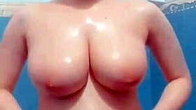 hidden cam in bathroom catches milf masturbating her big tits