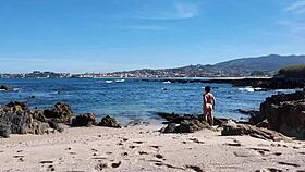 curvy nudist enjoys the beach with her natural hairy body, flashing occasionally