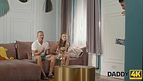 Young girlfriend cheats with older man on sofa