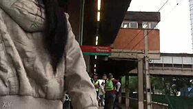 woman in jacket and boots rides train candidly