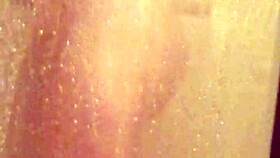 shy girl steps into steamy shower for intimate bathing moment