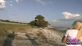 Tanned blonde flashes shaved pussy and natural tits in public park tease