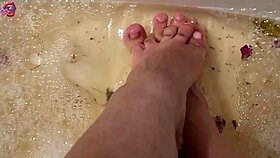 barefoot beauty washes feet with rose petals after long day